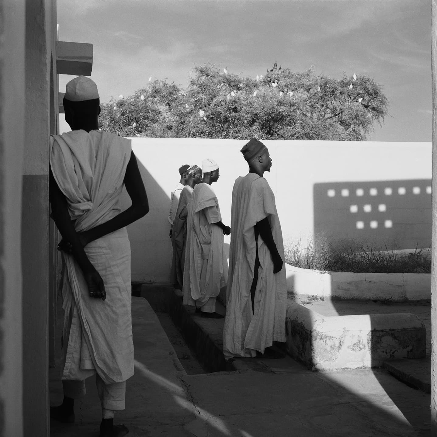 Attendants by Perforated Mud Wall