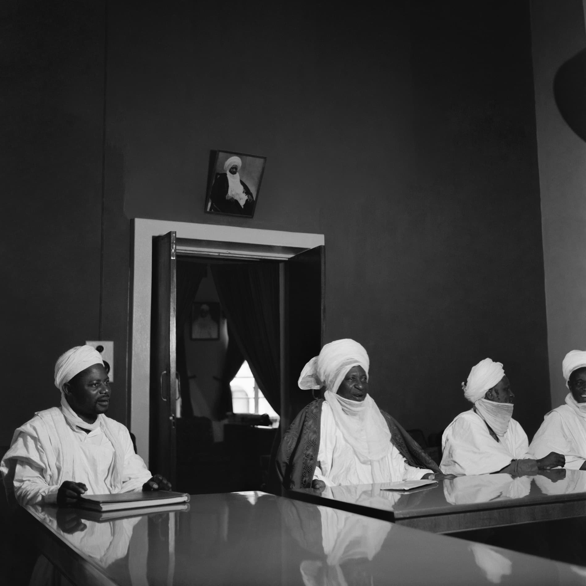 Archival Plate V • Scholars and traditional leadership assembled in council.