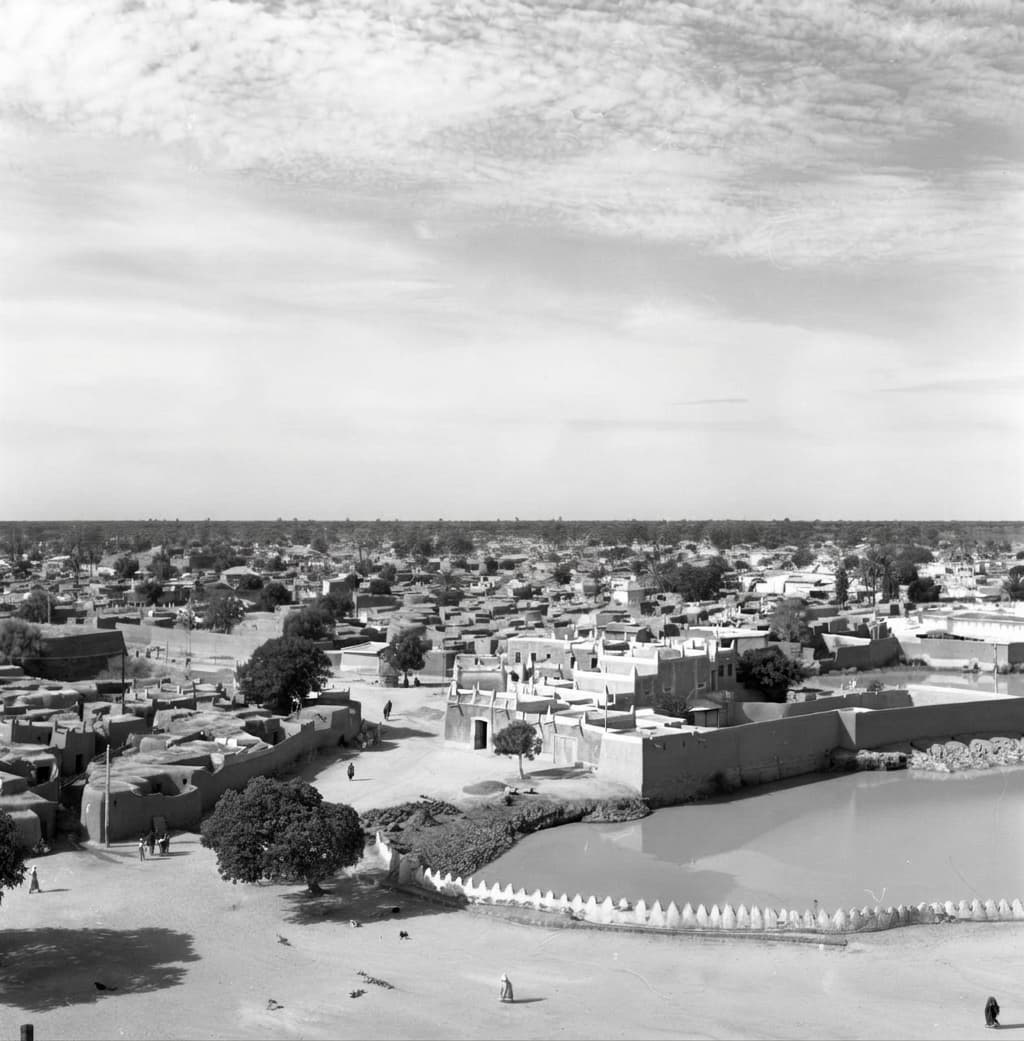 Archival Plate II • Panorama of historic Kano earthen compounds, ponds, and open horizons.